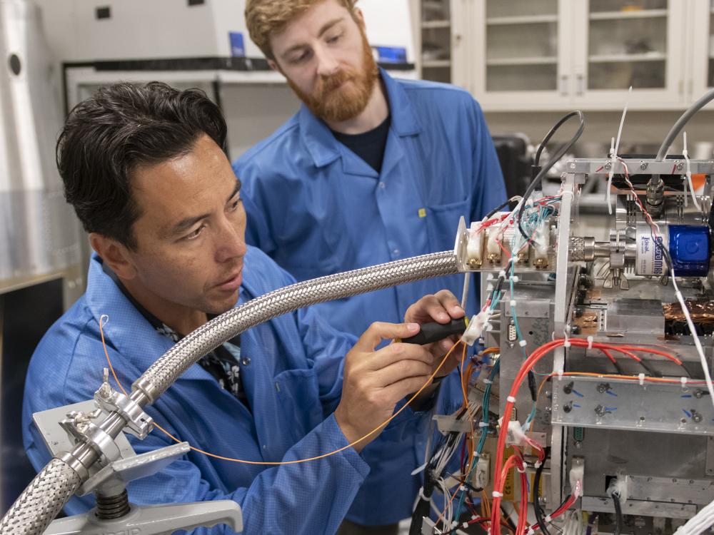 Randall McEntaffer working on flight electronics